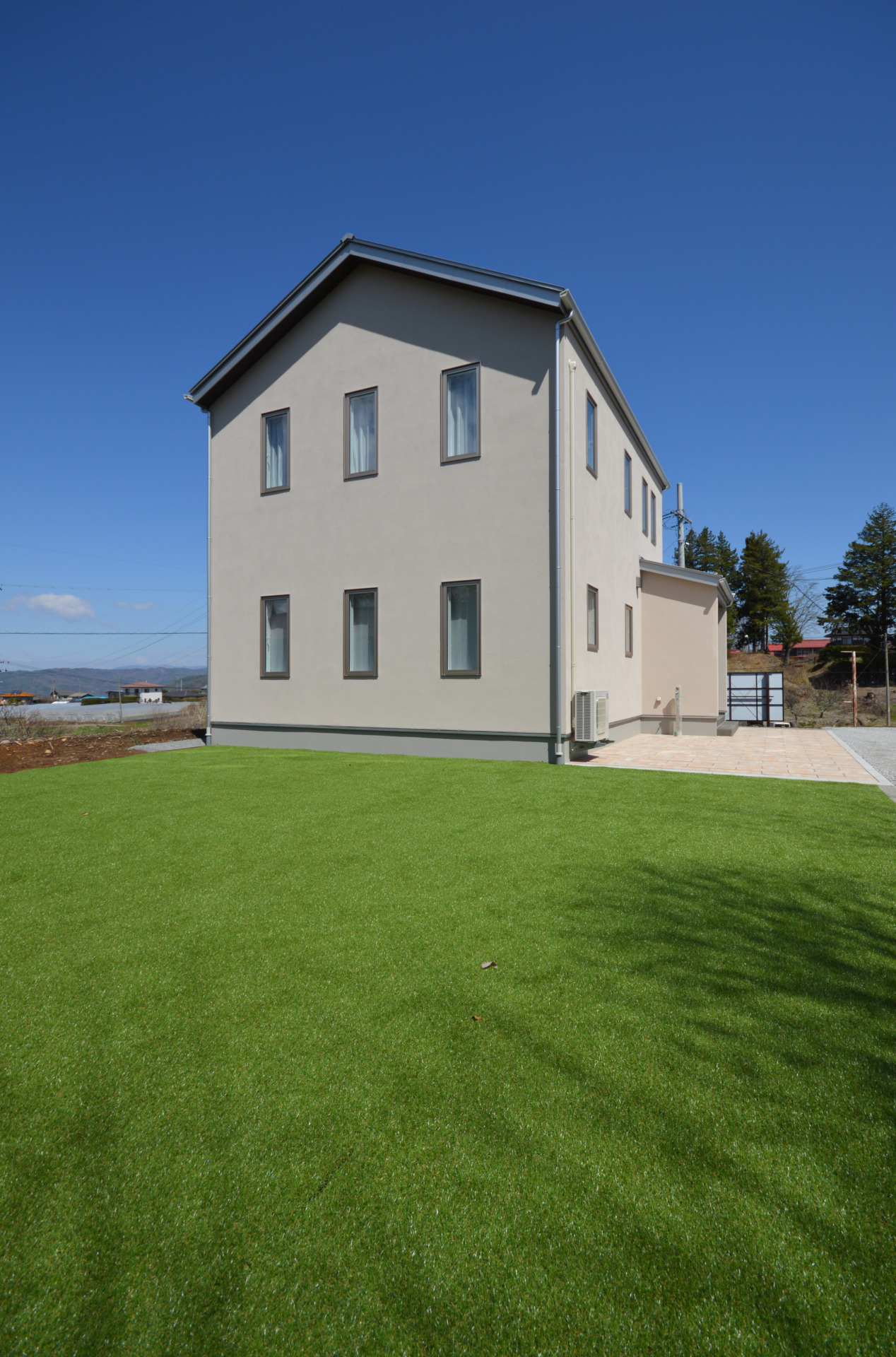 mamanベースの外観｜塗り壁外壁でどこからみても可愛い